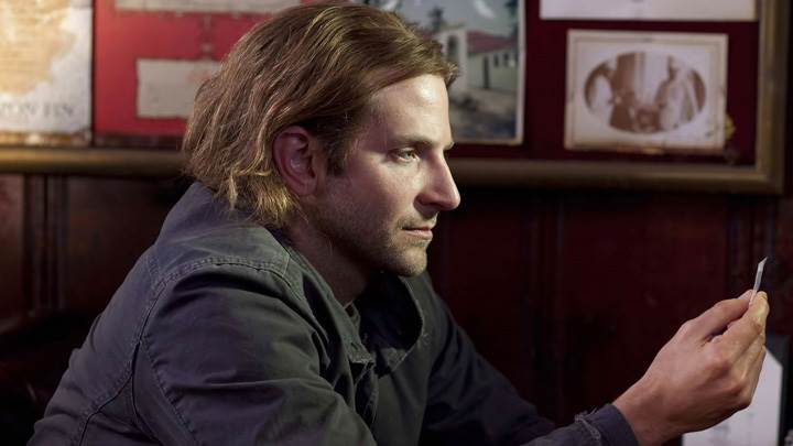 Bradley Cooper In Black Jacket Sitting Side Pose Photoshoot